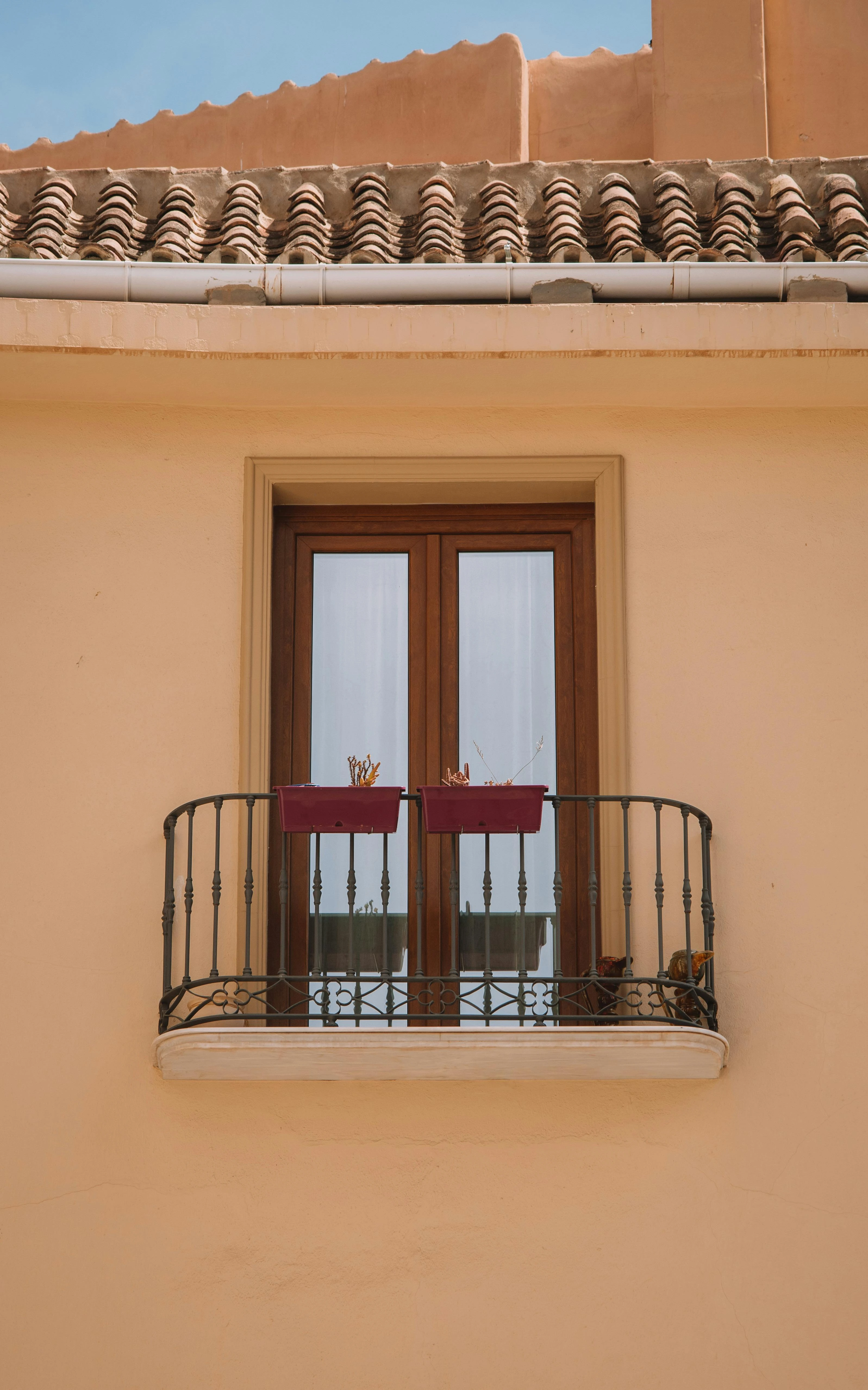 Rustic balcony with vintage iron fencing