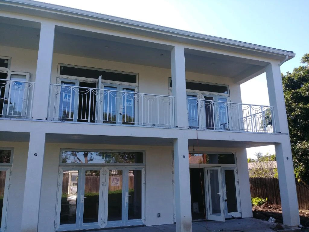 Charming balcony featuring decorative iron railing