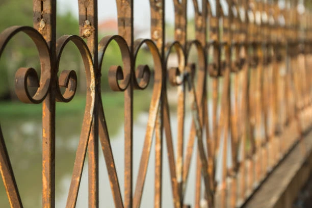 Iron picket fence in front of a house 