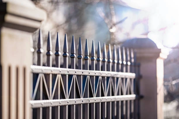 Artistic iron fence with scrollwork 