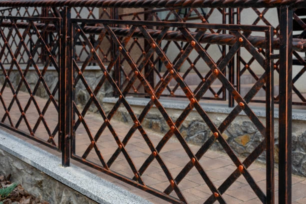 Iron fence posts with finial caps 