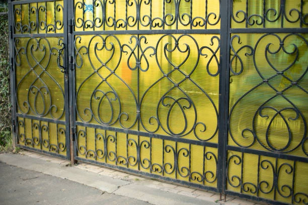 Iron fencing along a park pathway 