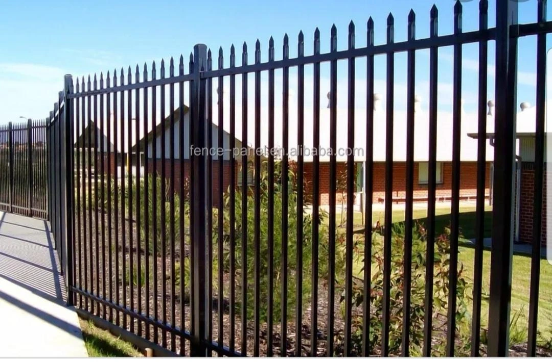 Black metal fence with ornate details 