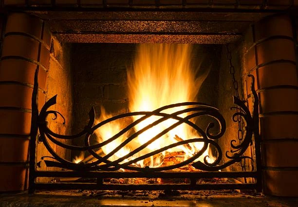 Elegant iron fireplace with decorative scrollwork 