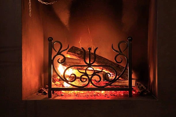 Industrial-style iron fireplace with raw finish 
